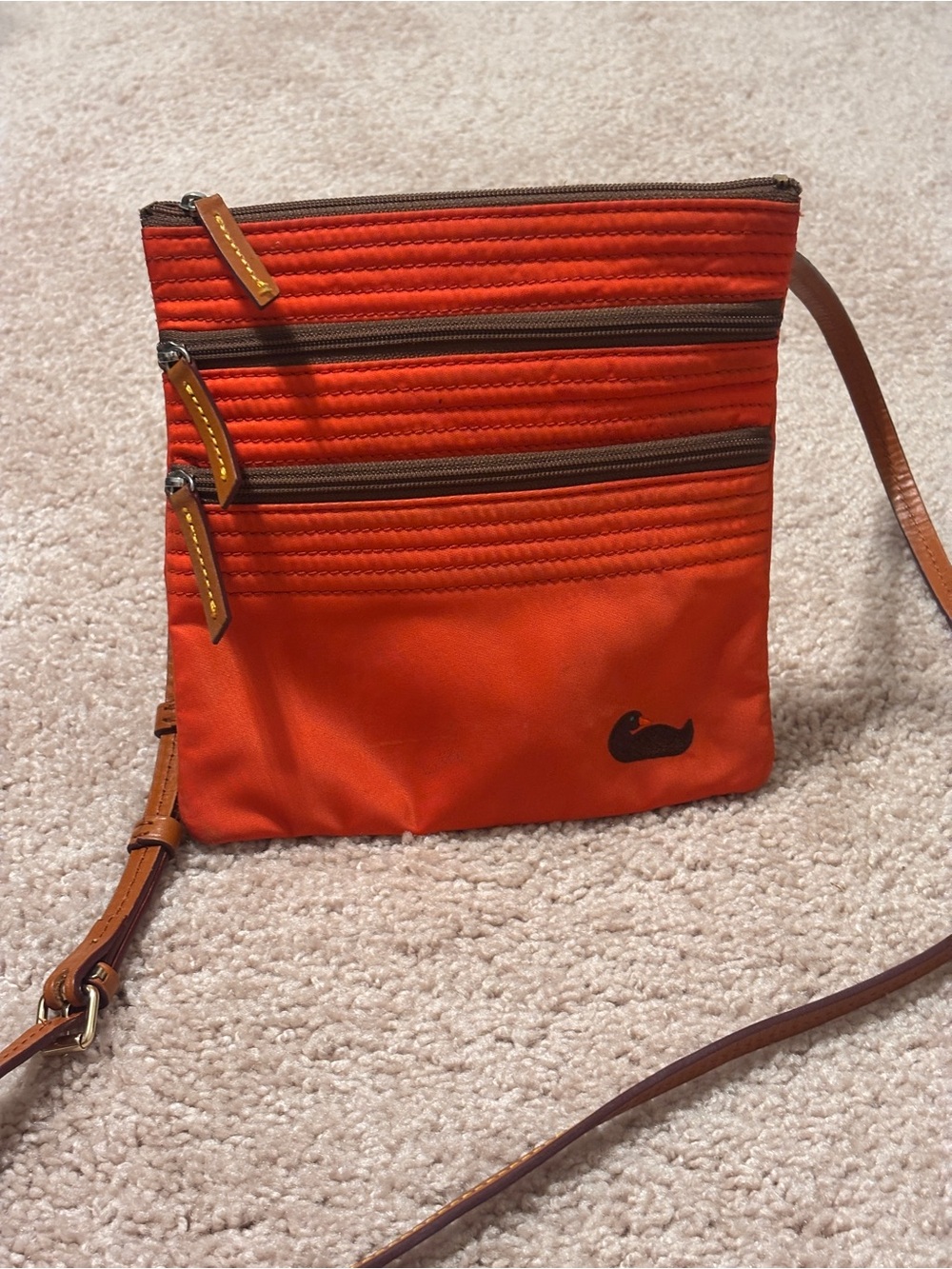 Dooney & Bourke Bright Orange Crossbody with Brown Leather Logo Patch
